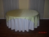 Round table with yellow linen